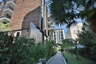 a sidewalk in front of a building with trees at VICTOR HUGO AP4159 Nice, by Riviera Holiday Homes in Nice