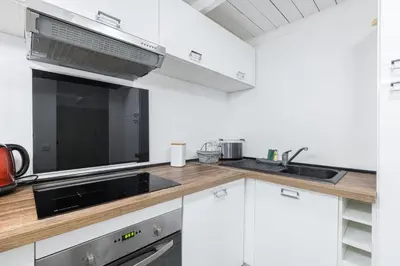 a kitchen with a sink and a microwave at Duplex in Rue de la Préfecture Old Town 2 Bdrs in Nice