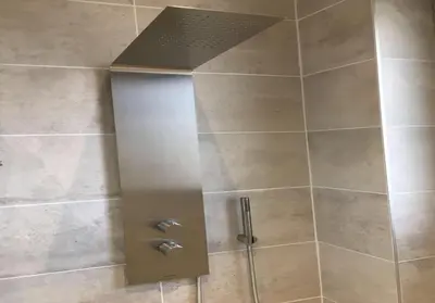a shower with a glass door and a shower head at Nice Jean Médecin in Nice