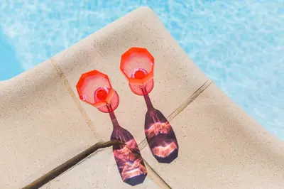two spoons on a napkin next to a pool at LA CASETTA DEI FIORI VI3078 in Nice