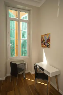 a room with a desk and a laptop and a window at Old Town Luxury 3 Beds in Nice