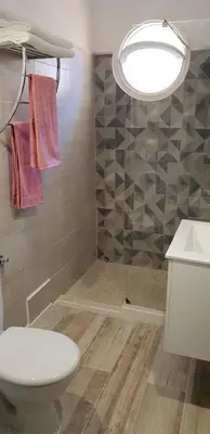 a bathroom with a toilet and a sink and a shower at Studio Lou Nidou, Nice Centre in Nice