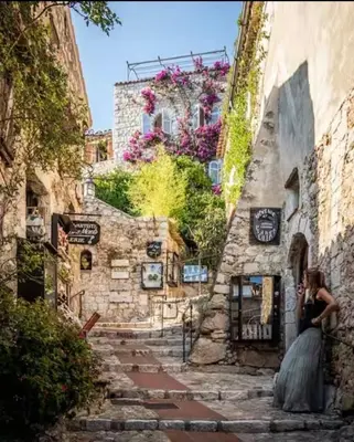 a bride and groom standing outside of a building at STUDIO pied village EZE - dans VILLA - Parking Gratuit in Èze