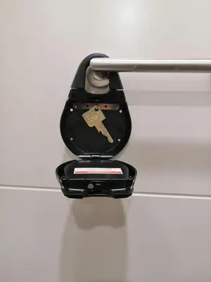 a black toilet with a metal handle on a wall at Alex Nice Studio in Nice