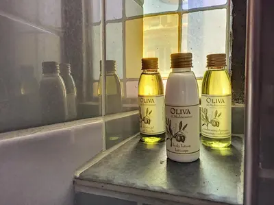 three bottles of oil sitting on a window sill at Nestor&Jeeves - RED TOUCH - Central - Close sea in Nice