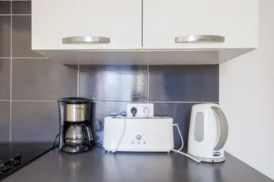a kitchen counter with a blender and a toaster at Prestige Designer Apartment, Super Central in Nice