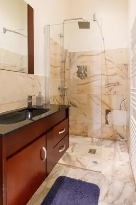 a bathroom with a sink and a shower at Prestige Designer Apartment, Super Central in Nice