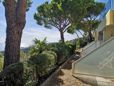 a glass house with a view of trees at Les Terrasses d'Eze - Hôtel & Spa in Èze