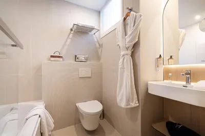 a bathroom with a toilet and a sink at Albert 1er in Nice