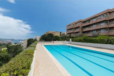 a swimming pool on the side of a building at Studio Le Fabrina Riviera in Nice