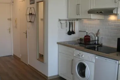 a kitchen with a washing machine in a kitchen at Studio Le Fabrina Riviera in Nice