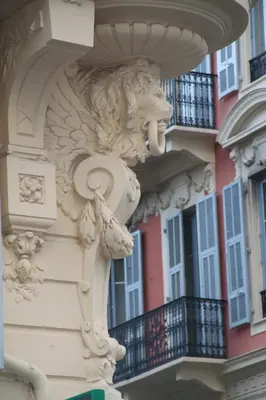 a statue of a lion on the side of a building at Hôtel Le Seize, Nice Centre in Nice