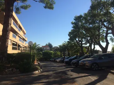 a row of cars parked in a parking lot at AZURELLE in Nice