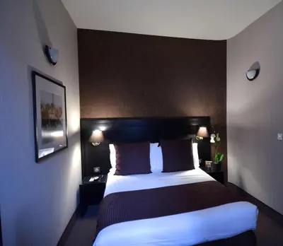 a hotel room with a large bed in it at Best Western Plus Nice Cosy Hotel in Nice