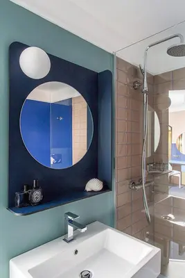 a bathroom with a sink and a shower and a mirror at Hôtel les Cigales in Nice