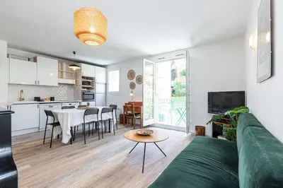 a living room with a couch and a table at 2 Bdrs & Parking in the Old Town ! in Nice