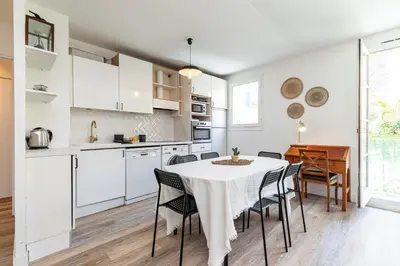 a kitchen and dining room with a table and chairs at 2 Bdrs & Parking in the Old Town ! in Nice