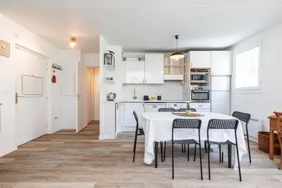 a kitchen and dining room with a table and chairs at 2 Bdrs & Parking in the Old Town ! in Nice