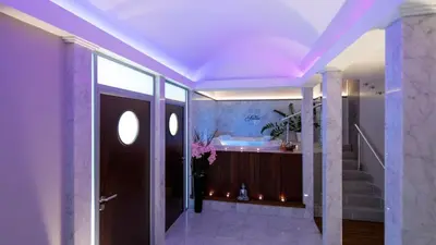 a bathroom with a bath tub and a staircase at Splendid Hotel & Spa Nice in Nice