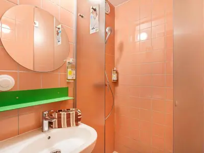 a bathroom with a sink and a shower at Greet Hotel Nice Aéroport Promenade des Anglais in Nice