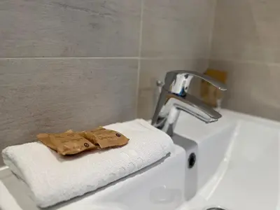 a towel sitting on top of a sink in a bathroom at Trocadero in Nice