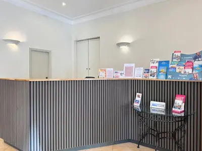 a lobby with a black and white striped wall at Trocadero in Nice