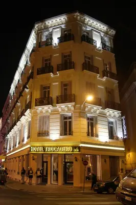 a large white building with a hotel projected on it at Trocadero in Nice