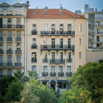 a tall building with balconies on the side of it at Hotel Aria in Nice