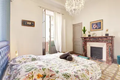 a bedroom with a bed and a fireplace at Le Philibert - SPLENDID, 6 BEDROOMS, 12P, NICE PORT, Air Cond in Nice