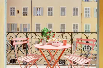 a table and two chairs on a balcony at Le Philibert - SPLENDID, 6 BEDROOMS, 12P, NICE PORT, Air Cond in Nice
