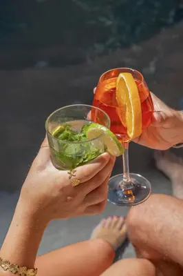 a person holding a drink in their hands at Nice Excelsior Centre ville by HappyCulture in Nice