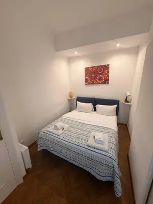 a bedroom with a bed with two towels on it at Le Savoy Palace - Five Stars Holiday House in Nice