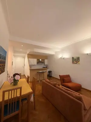 a living room with a couch and a table at Le Savoy Palace - Five Stars Holiday House in Nice