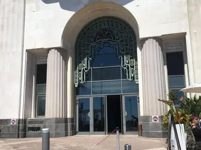 an entrance to a building with a large glass door at Quiet flat next to the beach in Nice