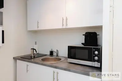 a kitchen with a microwave and a sink at Mini Suite Bijou - Five Stars Holiday House in Nice