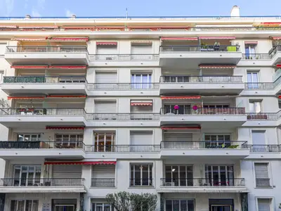 a tall white building with balconies and windows at Apartment Le Mozart by Interhome in Nice