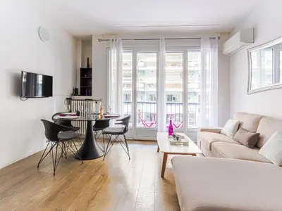 a living room with a couch and a table at Apartment Le Mozart by Interhome in Nice