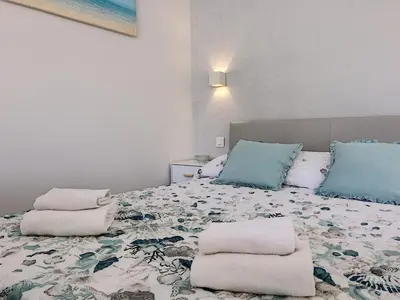 a bedroom with a bed with two pillows on it at Nestor&Jeeves - BLUE OCEAN - Central - Very close beaches in Nice