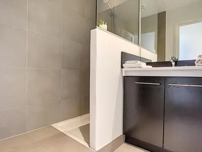 a bathroom with a sink and a mirror at Nestor&Jeeves - SEA VIEW TERRACE PENTHOUSE - Exceptional terrace - Top floor in Nice
