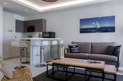 a living room with a couch and a table at DALPOZZO HYPER CENTRE PROCHE MER in Nice