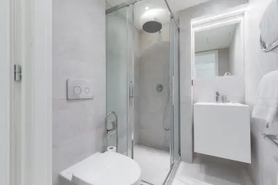 a bathroom with a shower and a toilet and a sink at DALPOZZO HYPER CENTRE PROCHE MER in Nice