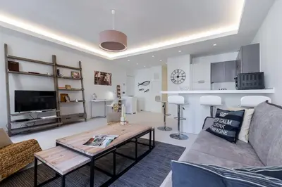 a living room with a couch and a table at DALPOZZO HYPER CENTRE PROCHE MER in Nice