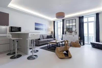 a living room with a couch and a table at DALPOZZO HYPER CENTRE PROCHE MER in Nice