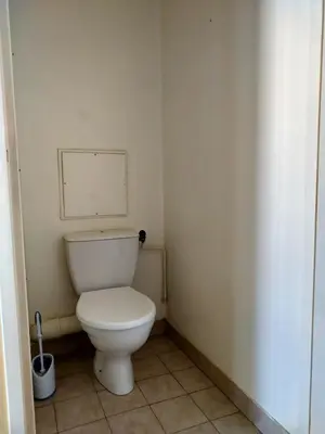 a bathroom with a white toilet in a room at Appartement F2 à 50 m de la plage in Nice