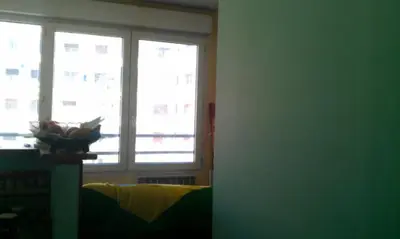 a room with two windows and a bowl on a table at Appartement F2 à 50 m de la plage in Nice