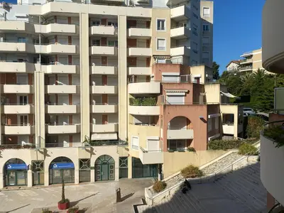 a large apartment building with a building at Palais des Arts, Proche Tram et Promenade in Nice