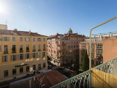 a view from a balcony of a city with buildings at Aida - rue Bosio in Nice