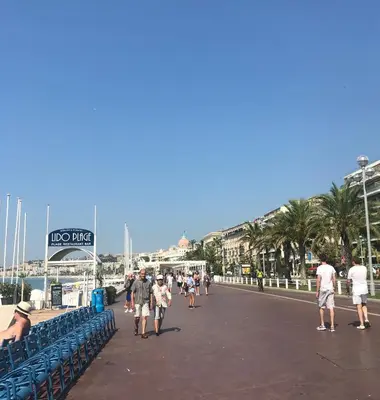 a group of people walking on a pier at Nice Apartment Roses & Ivy, Rue du Congres in Nice