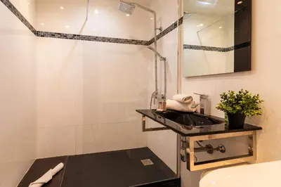 a bathroom with a sink and a shower at MASSENET VIEW AP4168 Nice, by Riviera Holiday Homes in Nice