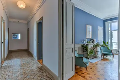 a hallway with blue walls and a door at Maison Bianchi - 24 Paul Deroulede in Nice